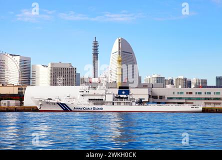 Yokohama City Skyline as viewed from Yokohama Bay in Kanagawa, Japan with a Japan Coast Guard boat in the foreground. Stock Photo