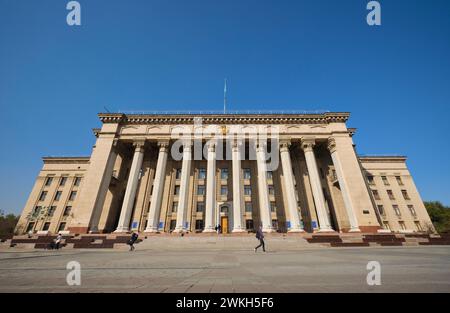 View of the front facade of the classical Kazakh-British Technical University, formally the communist era headquarters of the government Supreme Sovie Stock Photo