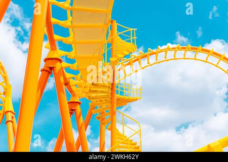 Rollercoaster railroad track high to the sky roll bend and twist for exciting fun at theme park Stock Photo