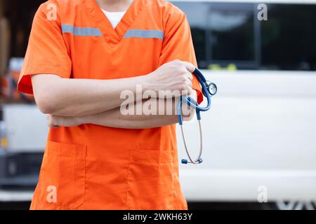 closeup paramedic man doctor medical emergency first aid mobile car team hand holding stethoscope Stock Photo