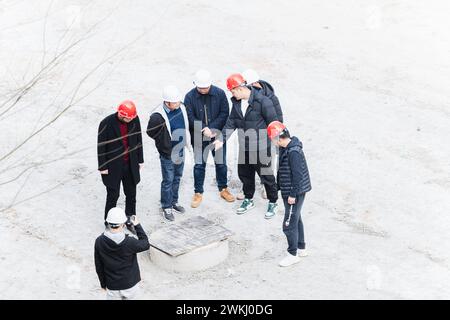 Workers checking quality at construction site Stock Photo