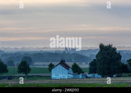 Isolated house in the countryside at sunrise on a summer morning Stock Photo