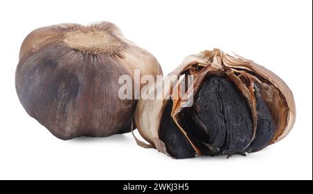Bulbs of fermented black garlic isolated on white Stock Photo
