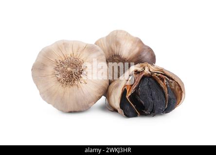 Bulbs of fermented black garlic isolated on white Stock Photo