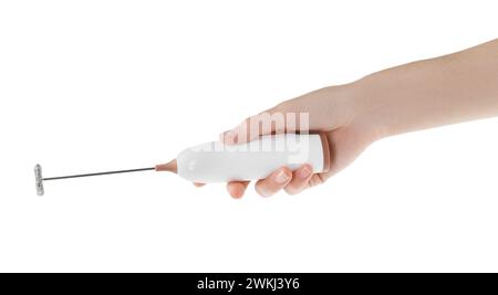 Woman holding milk frother wand on white background, closeup Stock Photo