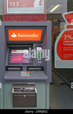 London, United Kingdom - January 19, 2013: Automated Teller Machine Santander Bank Atm Cash Withdrawals at Shop Window in London, UK. Stock Photo