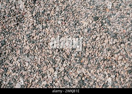 Fine pebbles on the beach on a sunny day Stock Photo