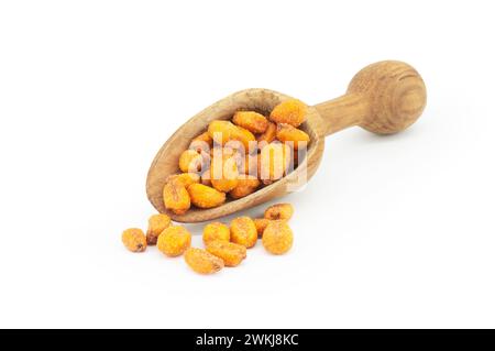 Roasted salted Corn Nuts with Spice and Sauce in wooden spoon isolated on white background Stock Photo