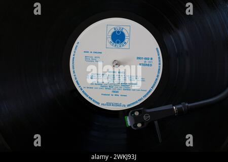 Focus Moving Waves vinyl record album LP with tonearm, cartridge, headshell and stylus on turntable record player - 1971 Stock Photo