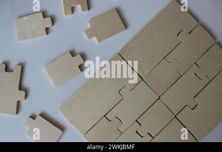 Plywood elements fitted to each other and separately on white surface Stock Photo