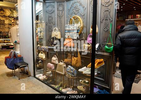 ISTANBUL, TURKEY - JANUARY 6 2024 bazaar in Istanbul. People shopping and walking throught the famous ancient bazaar with fake fashion, jewels, spice Stock Photo