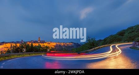 A horizontal 2:1 photo with a long exposure of an evening with bad weather and heavy rain over the town of Pitigliano in Tuscany, central Italy. Stock Photo
