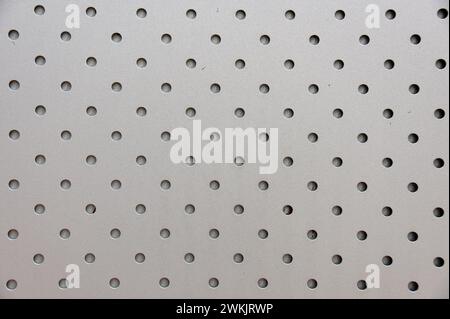 Holes and Dots in a Metal Wall Stock Photo