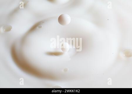Milk Splash Crown with Suspended Droplet in Macro View Stock Photo