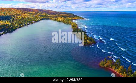 Aerial Autumn Forest and Turquoise Bay Contrast, Lake Superior Coast Stock Photo