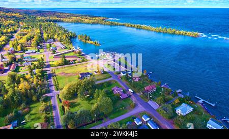 Aerial View of Serene Lakeside Town at Golden Hour, Michigan Stock Photo