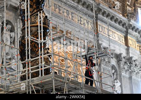 Restoration of the Baldacchino (canopy) over the high altar in Saint Peter's Basilica, Vatican on February 21, 2024. It is the first systematic and complete restoration of the Baldacchino of St Peter's Basilica, almost 400 years after work began on Gian Lorenzo Bernini's baroque masterpiece. The Baldacchino dates from the 1620s-1630s and it marks with its magnificence the place of the Tomb of the Apostle Peter under the high Altar. The restoration of the Baldacchino (about 700,000 euros) is being supported by the Knights of Columbus, a global Catholic fraternal order founded in 1882. The resto Stock Photo