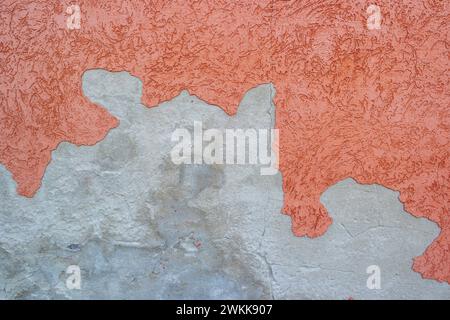 Peeling plaster on a house wall, structural damage Stock Photo