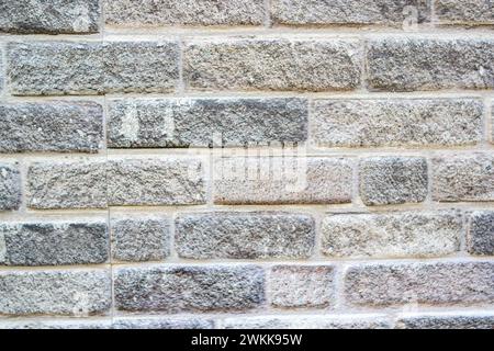 gray stone wall background with cement Stock Photo