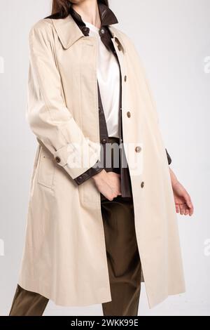 A sophisticated and timeless look for any occasion, this beige trench ...