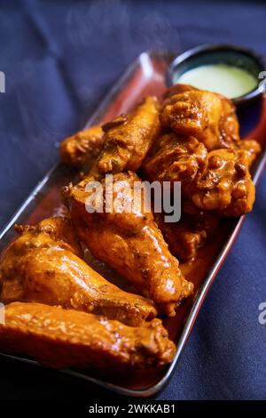 Fresh Buffalo Wings with Blue Cheese Dip Close-Up Stock Photo