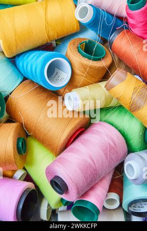 Colorful Sewing Threads in Creative Disarray, Top View Stock Photo