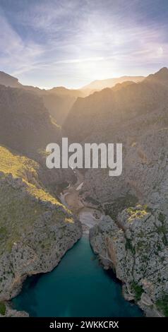 A vertical view of the Torrent de Pareis Gorge and beach on the rugged mountain coast of northern Mallorca Stock Photo