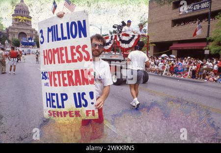 Austin Texas USA: Man holds sign advocating for assistance for homeless military veterans during victory parade in downtown Austin saluting soldiers returning from service in the Middle East during Desert Storm. ©Bob Daemmrich Stock Photo