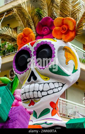 Giant Carnival Float with a Decorated Skull During Celebration of the Annual Parade in City Streets. Painted Skeleton Refers to the Day of the Dead. Stock Photo