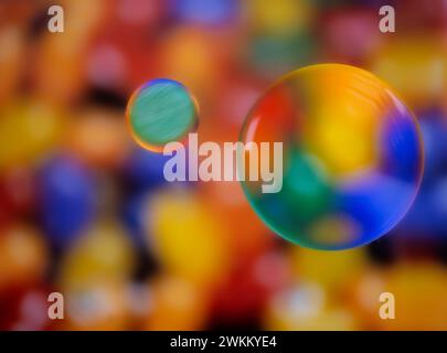 Colorful abstract macro background with oil drops in water Stock Photo