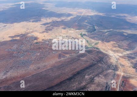 aerial cityscape with Black Nossob river and town  in desert,  shot from a glider plane in bright late spring light from north at Gobabis, Namibia, Af Stock Photo