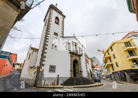 The whitewashed facade and bell tower of the 18th century St. Peter's Catholic Church, or Igreja de São Pedro, in Funchal Old Town on Madeira Island. Stock Photo