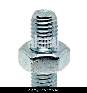 Close up of a single silver coloured bolt with the accompanying hex nut threaded onto the bolt, isolated against a white background. Stock Photo