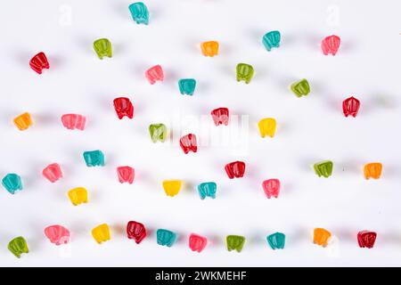 Colorful Gummy Bear Army Marching on White Background - Fun Candy Parade Concept, Top View, Bird View Stock Photo