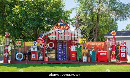 Vintage Skelly memorabilia and other antique objects on display in a yard on a summer day in urban St. Cloud, Minnesota USA. Stock Photo