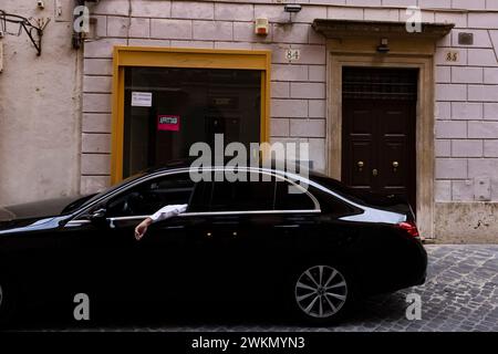 A driver waits on a narrow side street adjacent to RomeÕs high end shopping district on Via dei Condotti where Prada, Gucci, BVLGARI, Dior and others Stock Photo