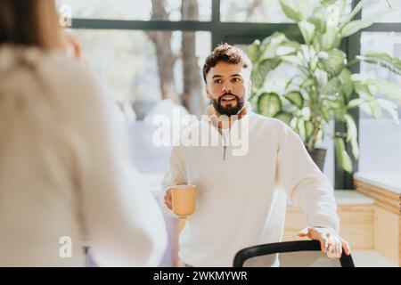 Diverse business team collaborating, analyzing market research and discussing project details for business expansion. Stock Photo