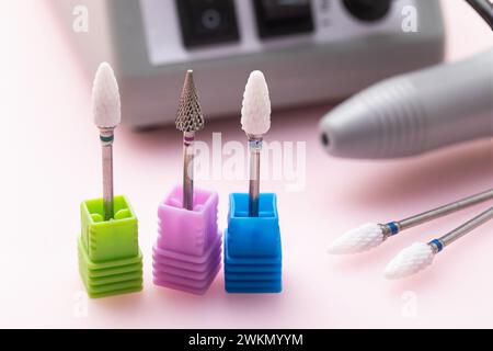Three different ceramic cutters for hardware manicure and pedicure on a colored background close-up Stock Photo