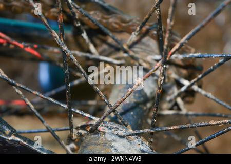 Spokes on an old rusty bicycle back tire. Stock Photo