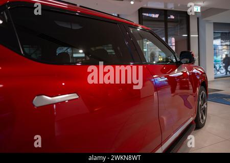 new red Vinfast vf 8 electric SUV in Studio, advanced technologies in vietnamese automotive industry, Environmental sustainability, Car dealerships, t Stock Photo