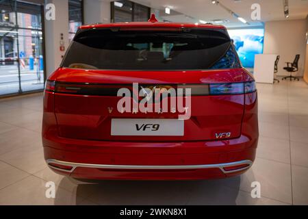 new red Vinfast vf 8 electric SUV in Studio, advanced technologies in vietnamese automotive industry, Environmental sustainability, Car dealerships, t Stock Photo