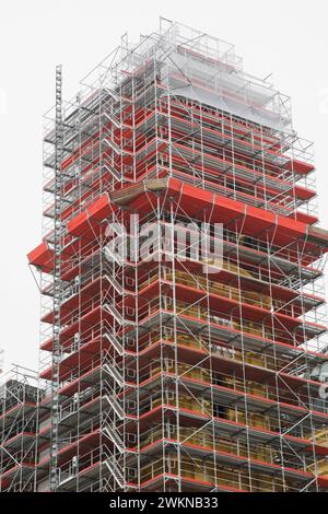 Building exterior with scaffolding undergoing construction and renovation work, Munich, Germany. Stock Photo