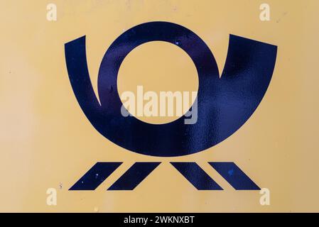 Post horn, German Post horn on yellow background, Germany Stock Photo