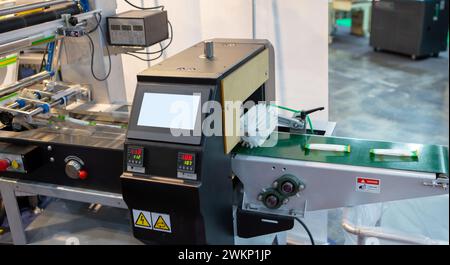 Automatic food flow wrapping machine. Food packaging machine Stock Photo