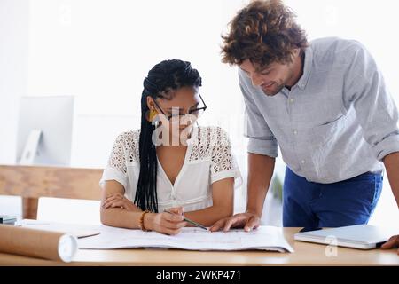 Blueprint, architect and team in office, training or help with construction project for building in startup. Engineer, collaboration and paperwork for Stock Photo
