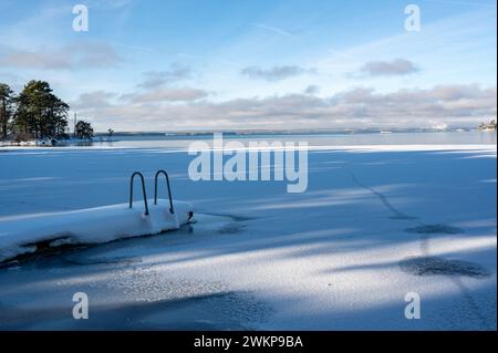 Jetty with ladder covered in snow Motala Sweden Stock Photo