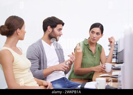Businessman, plan and team for idea, discussion and company career as software developers. Professional male person, women and talking in office, desk Stock Photo
