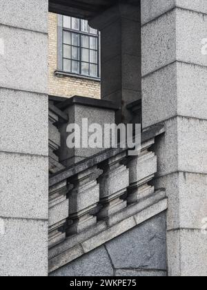 A unique view of a granite staircase juxtaposed against the external corner of a building, creating a visually striking geometric pattern. The stairca Stock Photo