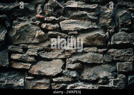 textured stone wall in a medieval city Stock Photo