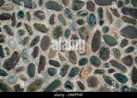 textured stone wall in a medieval city Stock Photo